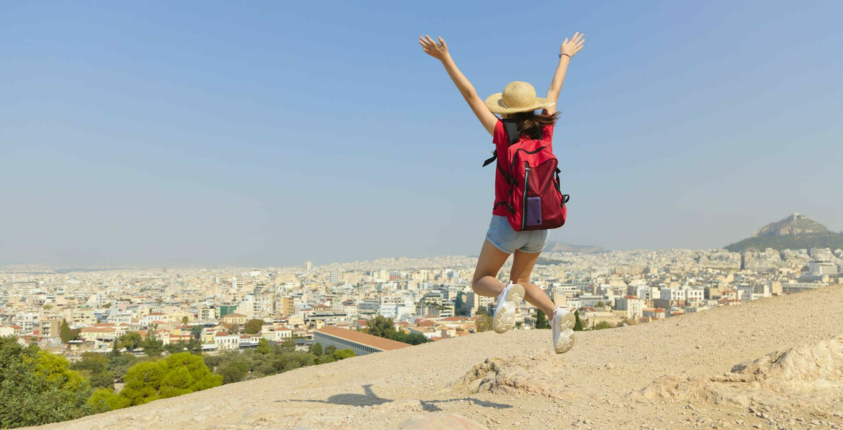 bigstock-Happy-girl-is-jumping-in-Athen-347561323